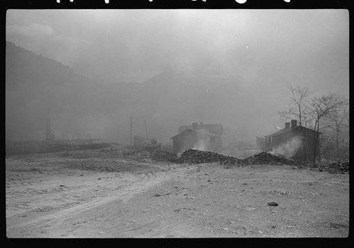 Coke ovens and burning slag heaps make heavy impenetrable smoke over whole town, day and night. Longacre, West Virginia
