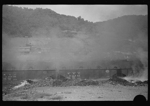 Untitled photo, possibly related to: Coke ovens and burning slag heaps make heavy impenetrable smoke over whole town, day and night. Longacre, West Virginia