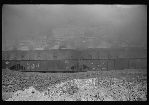 Untitled photo, possibly related to: Coke ovens and burning slag heaps make heavy impenetrable smoke over whole town, day and night. Longacre, West Virginia