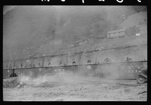 Untitled photo, possibly related to: Coke ovens and burning slag heaps make heavy impenetrable smoke over whole town, day and night. Longacre, West Virginia