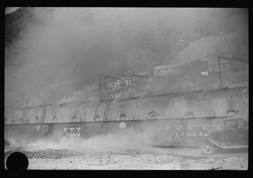 Untitled photo, possibly related to: Coke ovens and burning slag heaps make heavy impenetrable smoke over whole town, day and night. Longacre, West Virginia