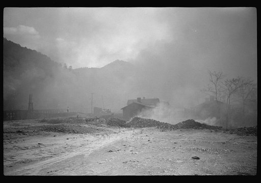 Untitled photo, possibly related to: Coke ovens and burning slag heaps make heavy impenetrable smoke over whole town, day and night. Longacre, West Virginia