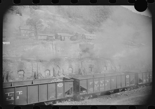 Untitled photo, possibly related to: Coke ovens make heavy impenetrable smoke over whole town. Workers' homes in background. Longacre, West Virginia