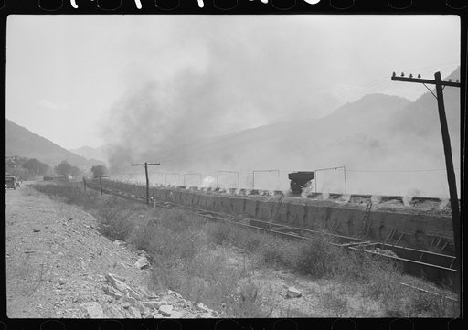 Coke ovens and burning slag heaps make heavy impenetrable smoke over whole town, day and night. Longacre, West Virginia