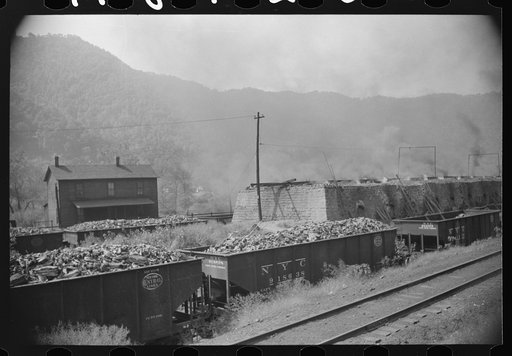Untitled photo, possibly related to: Coke ovens and burning slag heaps make heavy impenetrable smoke over whole town, day and night. Longacre, West Virginia