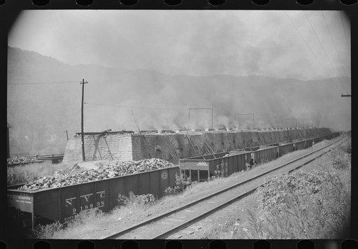 Coke ovens and burning slag heaps make heavy impenetrable smoke over whole town, day and night. Longacre, West Virginia