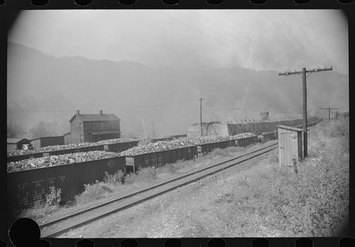 Untitled photo, possibly related to: Coke ovens and burning slag heaps make heavy impenetrable smoke over whole town, day and night. Longacre, West Virginia