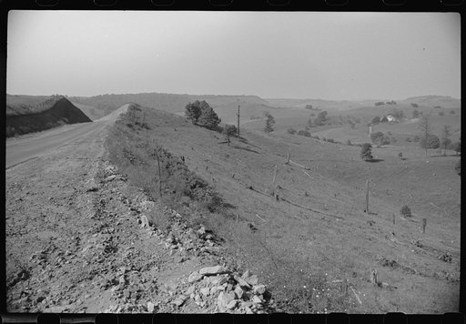 Highway cutting across poor farmland between Morgantown and Elkins, West Virginia