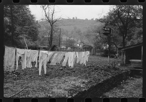 Clothesline in front yard of coal and slate. Abandoned mining town, Jere, West Virginia