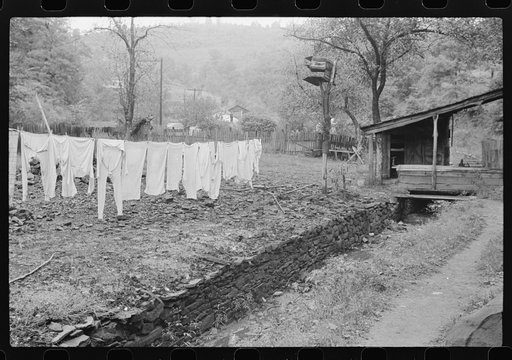 Untitled photo, possibly related to: Clothesline in front yard of coal and slate. Abandoned mining town, Jere, West Virginia
