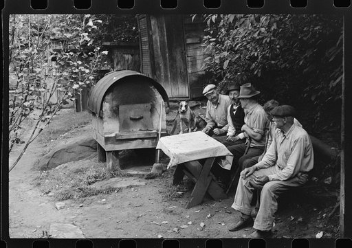 Untitled photo, possibly related to: Bohemian miners (coal loaders) unemployed since mechanization of mines. Jere, West Virginia. They live together in one house with a woman housekeeper. All on relief. Spend most of their time fighting about politics. Call their dog "Hitler" because he's so mean an