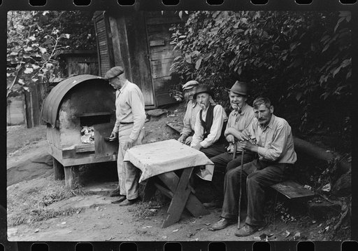 Untitled photo, possibly related to: Bohemian miners (coal loaders) unemployed since mechanization of mines. Jere, West Virginia. They live together in one house with a woman housekeeper. All on relief. Spend most of their time fighting about politics. Call their dog "Hitler" because he's so mean an
