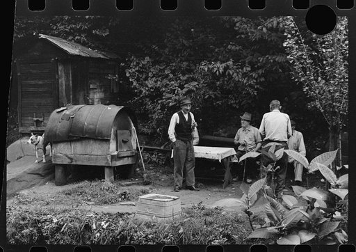 Untitled photo, possibly related to: Bohemian miners (coal loaders) unemployed since mechanization of mines. Jere, West Virginia. They live together in one house with a woman housekeeper. All on relief. Spend most of their time fighting about politics. Call their dog "Hitler" because he's so mean an