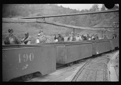Untitled photo, possibly related to: The "trip" coming out of the mines at the end of the day shift. This mine has many safety regulations. The men cannot leave their car until the one in front has been emptied. Maidsville, West Virginia