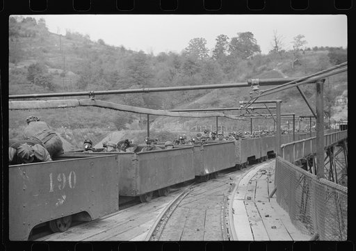 Untitled photo, possibly related to: The "trip" coming out of the mines at the end of the day shift. This mine has many safety regulations. The men cannot leave their car until the one in front has been emptied. Maidsville, West Virginia