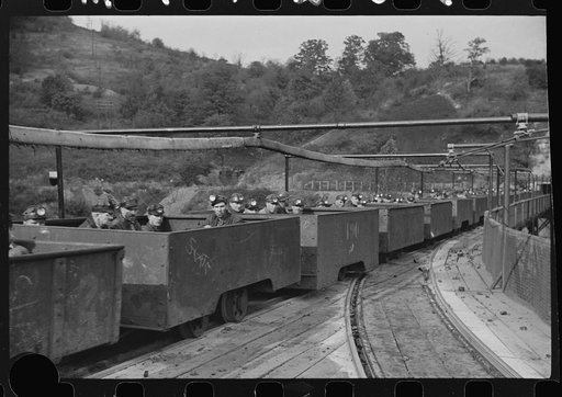 Untitled photo, possibly related to: The "trip" coming out of the mines at the end of the day shift. This mine has many safety regulations. The men cannot leave their car until the one in front has been emptied. Maidsville, West Virginia