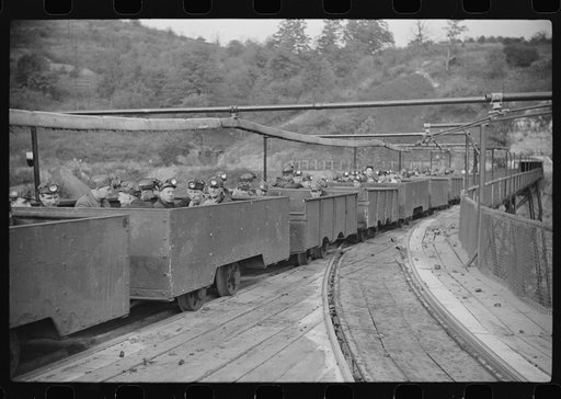 Untitled photo, possibly related to: The "trip" coming out of the mines at the end of the day shift. This mine has many safety regulations. The men cannot leave their car until the one in front has been emptied. Maidsville, West Virginia