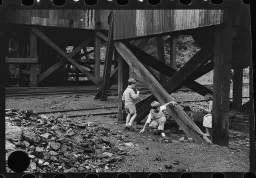 Untitled photo, possibly related to: Children's favorite playground, around coal mine tipples. Pursglove, Scotts Run, West Virginia