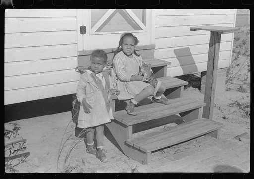 Children on the steps of Mrs. Brown's home. FSA (Farm Security Administration) borrower on Prairie Farms, Montgomery, Alabama