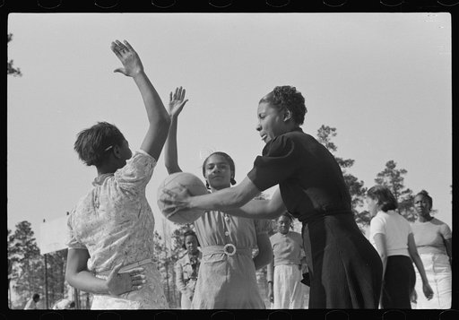 Untitled photo, possibly related to: Student with recreational director during basketball game. Prairie Farms, Montgomery, Alabama