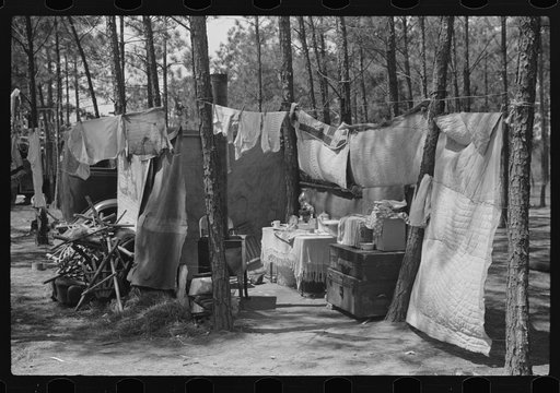 Home of one of two families who travel and work together all through the South, repairing stalls, stoves, tools, houses, and any other odd jobs. Tourist camp near Atlanta, Georgia