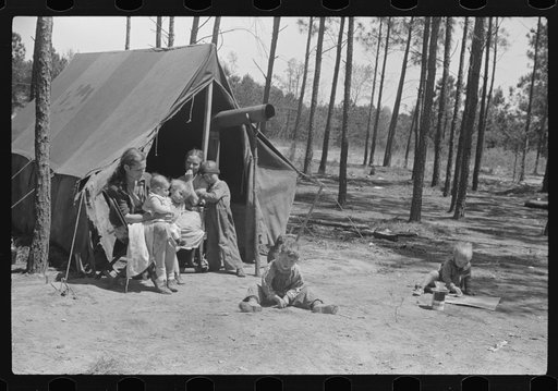 Home of one of two families who travel and work together all through the South, repairing stalls, stoves, tools, houses, and any other odd jobs. Tourist camp near Atlanta, Georgia