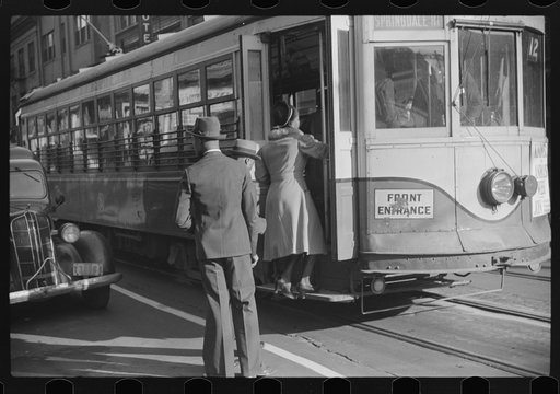 Domestic help boarding streetcar, Atlanta, Georgia