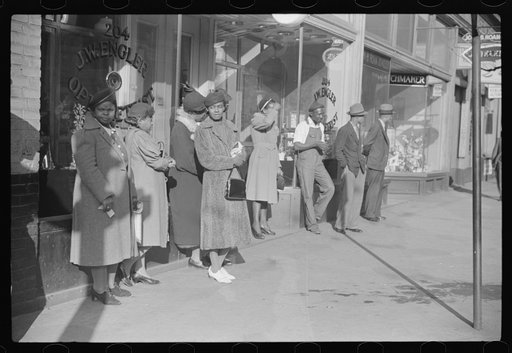 Untitled photo, possibly related to: Domestic servants waiting for streetcar on way to work early in the morning. Mitchell Street, Atlanta, Georgia