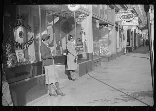 Domestic servants waiting for streetcar on way to work early in the morning. Mitchell Street, Atlanta, Georgia