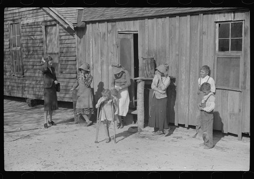 Untitled photo, possibly related to: Ten year old child of George Cowley Family (rural rehabilitation client). Her bones break exceptionally easy (diet deficiency said to be one of causes) and one leg has been broken five times and doesn't mend properly. Pike County, Alabama