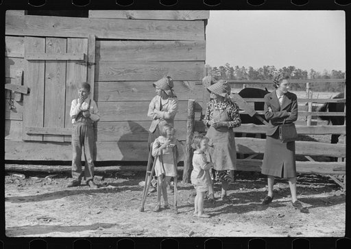George Cowley's family (rural rehabilitation) with home supervisor, discussing possibilities of further medical care and treatment for child on crutches. Her bones break exceptionally easy (diet deficiency one of causes) and one leg has been broken five times and doesn't mend properly. She is ten ye