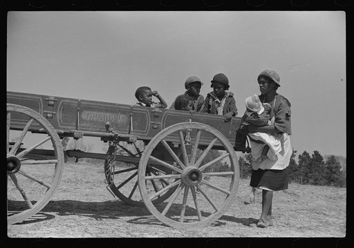 Untitled photo, possibly related to: Charlie McGuire's family (tenant purchase clients) and their new wagon, Pike County, Alabama