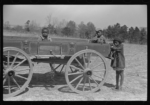 Untitled photo, possibly related to: Charlie McGuire's family (tenant purchase clients) and their new wagon, Pike County, Alabama