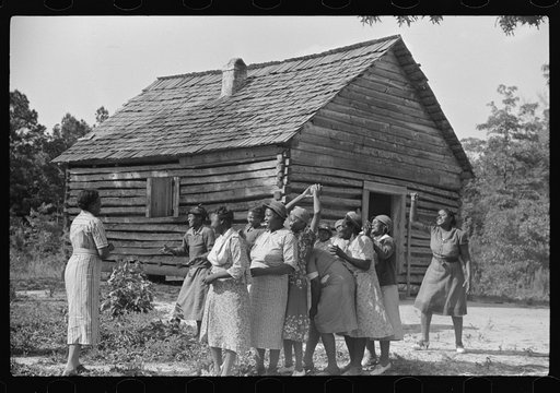 Juanita Coleman helps during recreation time for adult class. In the church she teaches them to read and write and to discuss any interests and problems. Gees Bend, Alabama