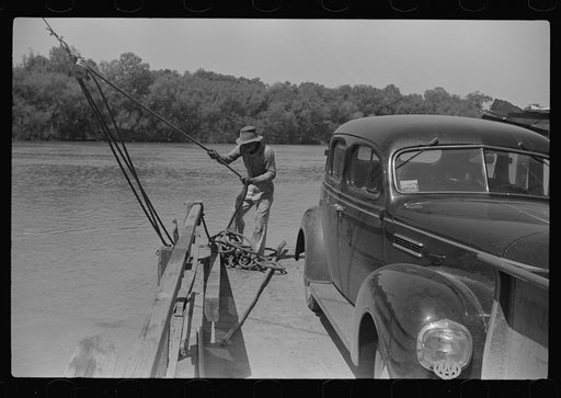 Steering the ferry for a landing at Gees Bend, Alabama