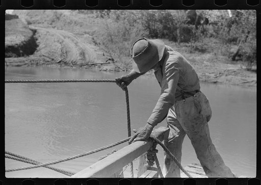 Steering the ferry for a landing at Gees Bend, Alabama