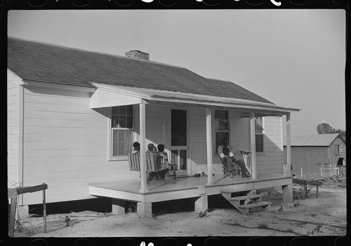 Nolan Pettway and some of his family on their front porch, Gees Bend, Alabama