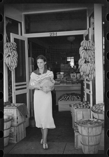 Shopper coming out of grocery store, Lakeland, Florida