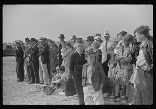 Homesteaders and townspeople and neighbors watching baseball game on May Day health day at Ashwood Plantation, South Carolina