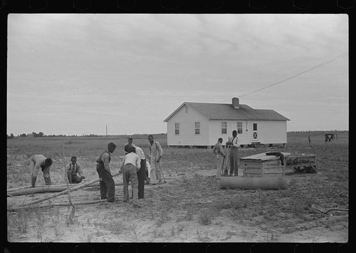 Untitled photo, possibly related to: Group of sixth and seventh grade boys constructing poultry yard fence. Brooder was built in their shop class at school. Flint River Farms, Georgia