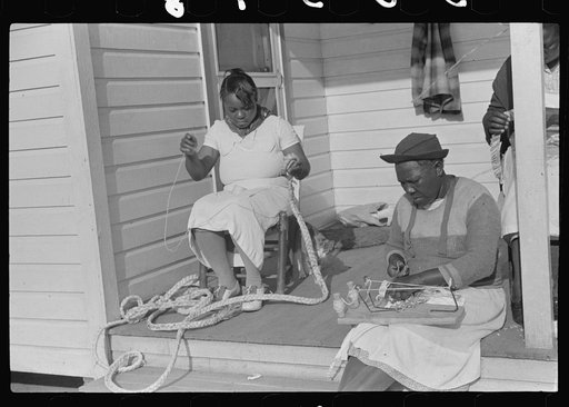 Home economics and home management class for adults under supervision of Evelyn M. Driver. Everything they make, including the hand looms, utilizes materials of local origin such as bamboo, cane, cornshucks, flour and meal and feed sacks, etc. Flint River Farms, Georgia