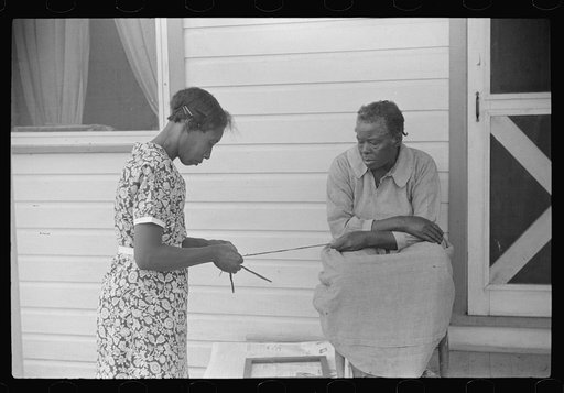 Untitled photo, possibly related to: Home economics and home management class for adults under supervision of Evelyn M. Driver. Everything they make, including the hand looms, utilizes materials of local origin such as bamboo, cane, cornshucks, flour and meal and feed sacks, etc. Flint River Farms, 
