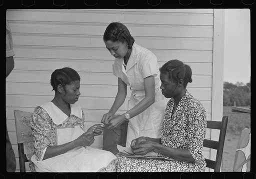 Home economics and home management class for adults under supervision of Evelyn M. Driver. Everything they make, including the hand looms, utilizes materials of local origin such as bamboo, cane, cornshucks, flour and meal and feed sacks, etc. Flint River Farms, Georgia