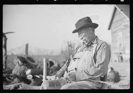 Untitled photo, possibly related to: Mixed-breed Indian, white and Negro, near Pembroke Farms, making new chair seat. North Carolina