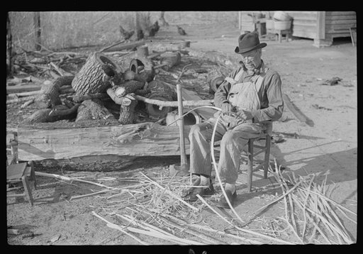Untitled photo, possibly related to: Mixed-breed Indian, white and Negro, near Pembroke Farms, making new chair seat. North Carolina