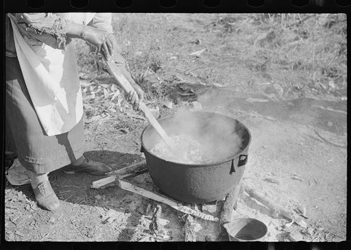 Untitled photo, possibly related to: Rendering fat after hog-killing. Near Maxton, North Carolina