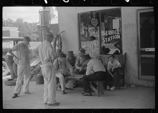 Playing cards outside service station, Saturday afternoon, Greensboro, Greene County, Georgia