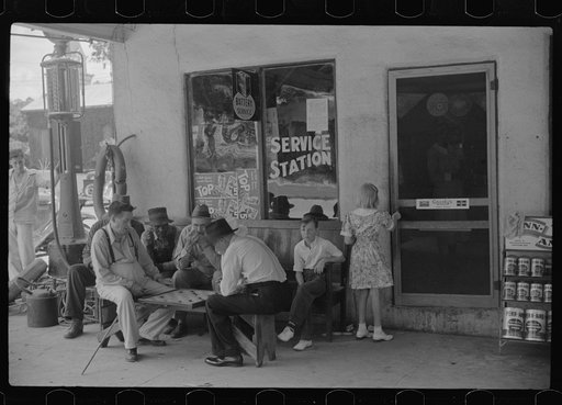 Untitled photo, possibly related to: Playing cards outside service station, Saturday afternoon, Greensboro, Greene County, Georgia