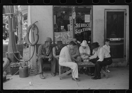 Greensboro, Greene County, Georgia. Playing checkers outside a service station on a Saturday afternoon