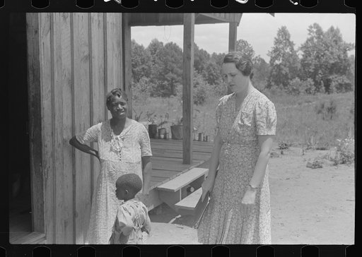 Untitled photo, possibly related to: FSA (Farm Security Administration) home management supervisor pointing out to rehabilitation borrower where new privy will be located. Greene County, Georgia